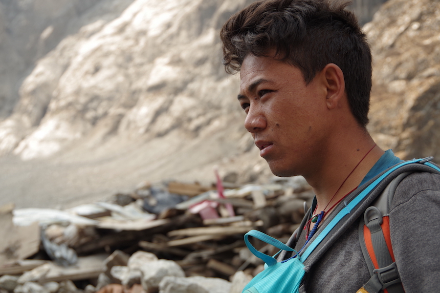 Nima's family home was levelled by the landslide. He hopes to rebuild within a year.