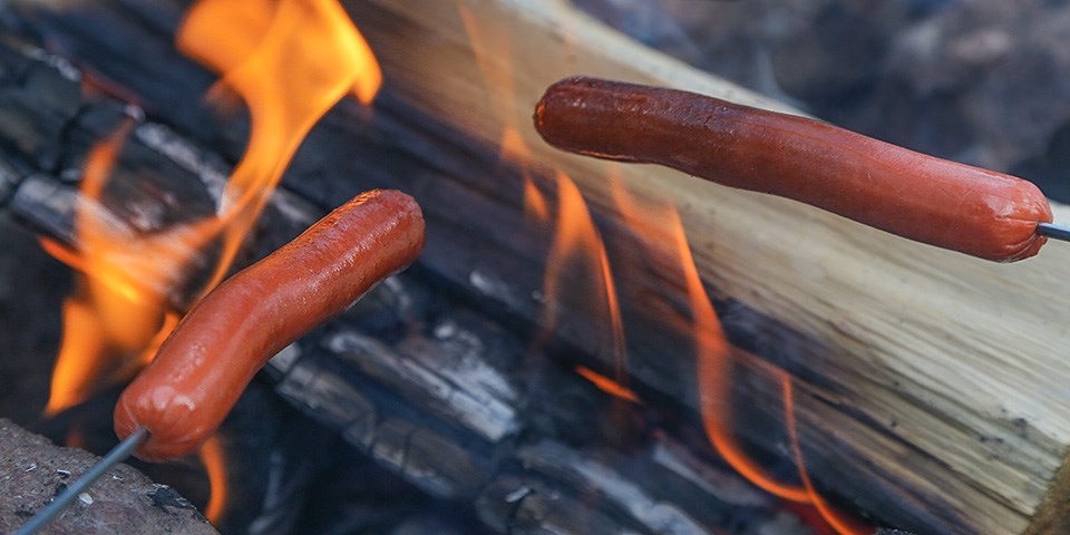 Cooking Sausages on Camp Fire